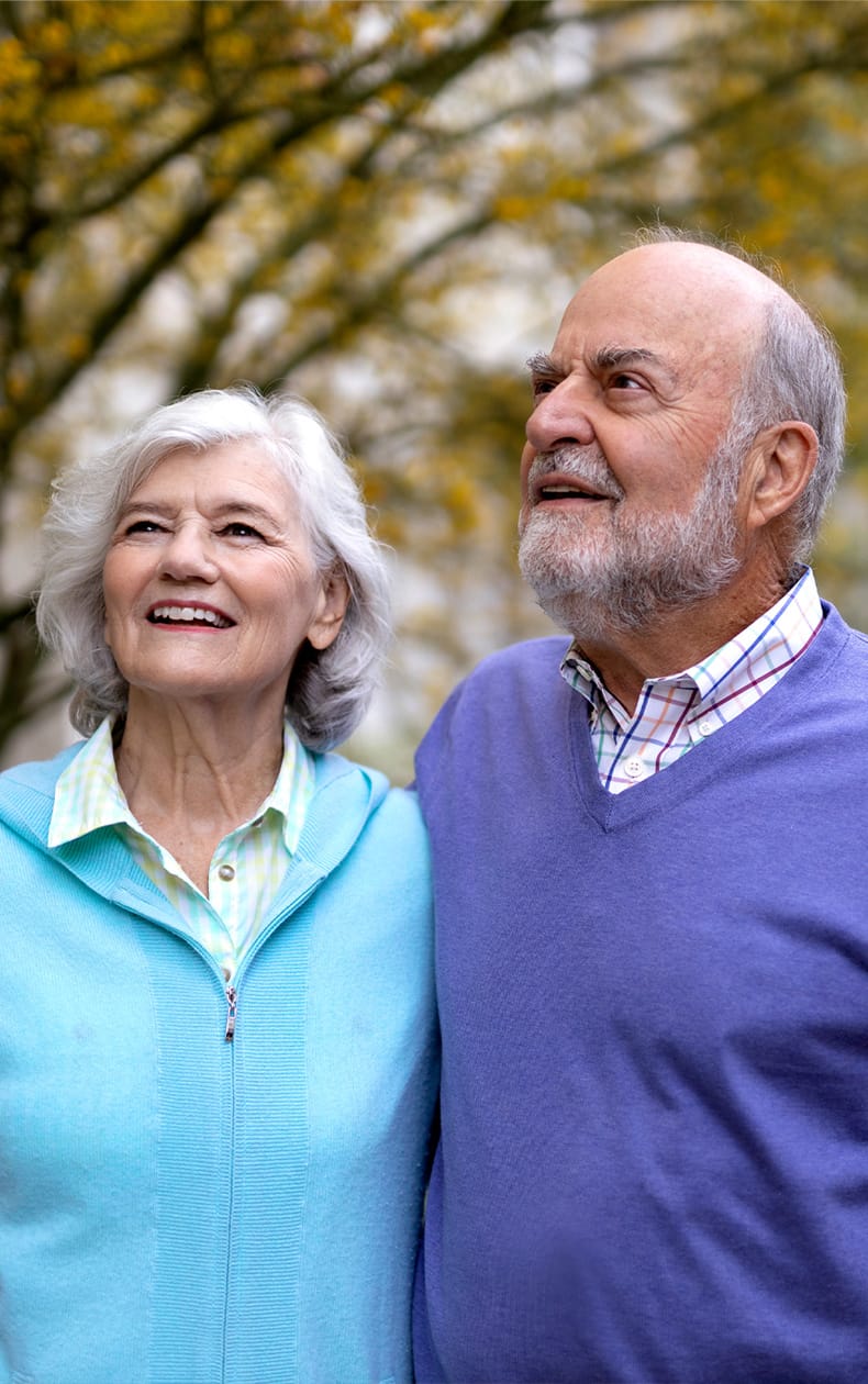 A smiling older man and woman enjoying luxury senior living in the Pasadena area at MonteCedro