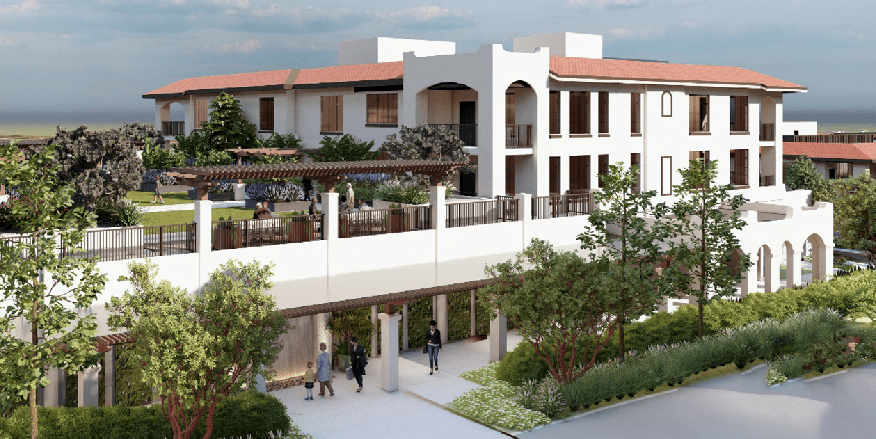 A modern, multi-story building with white walls, large windows, and terracotta roof tiles, surrounded by greenery and landscaped gardens. People are walking and gathering near the entrances and outdoor areas.