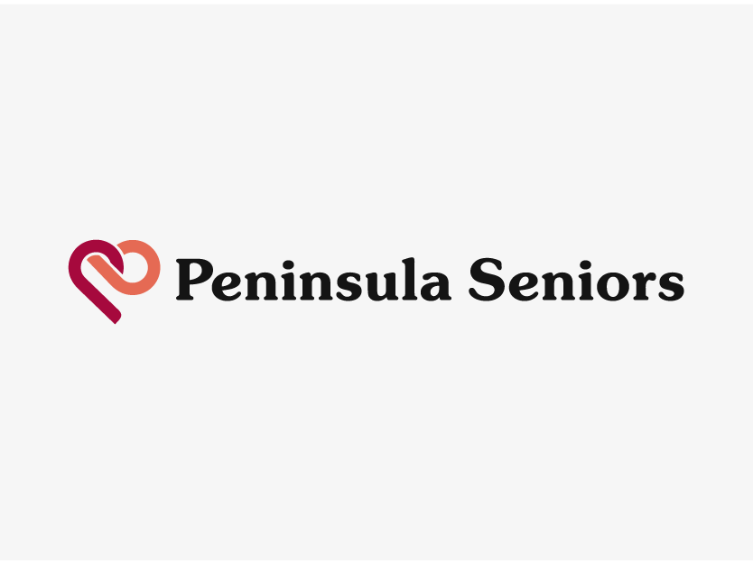 Logo for Peninsula Seniors with a heart-shaped design in red and orange to the left of the black text Peninsula Seniors on a white background.