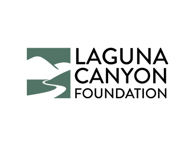 Logo of Laguna Canyon Foundation with a green square containing white stylized hills and a winding path, next to the text Laguna Canyon Foundation in bold black letters on a light background.