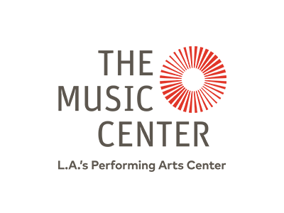Logo for The Music Center, L.A.s Performing Arts Center, featuring gray text and a red circular sunburst graphic to the right of the word THE.
