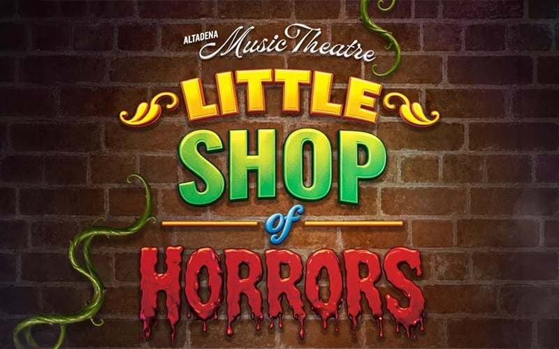 03-Story_07-LittleShop A brick wall with the text Altadena Music Theatre Little Shop of Horrors in colorful letters. Green vines and tentacles appear around the words.