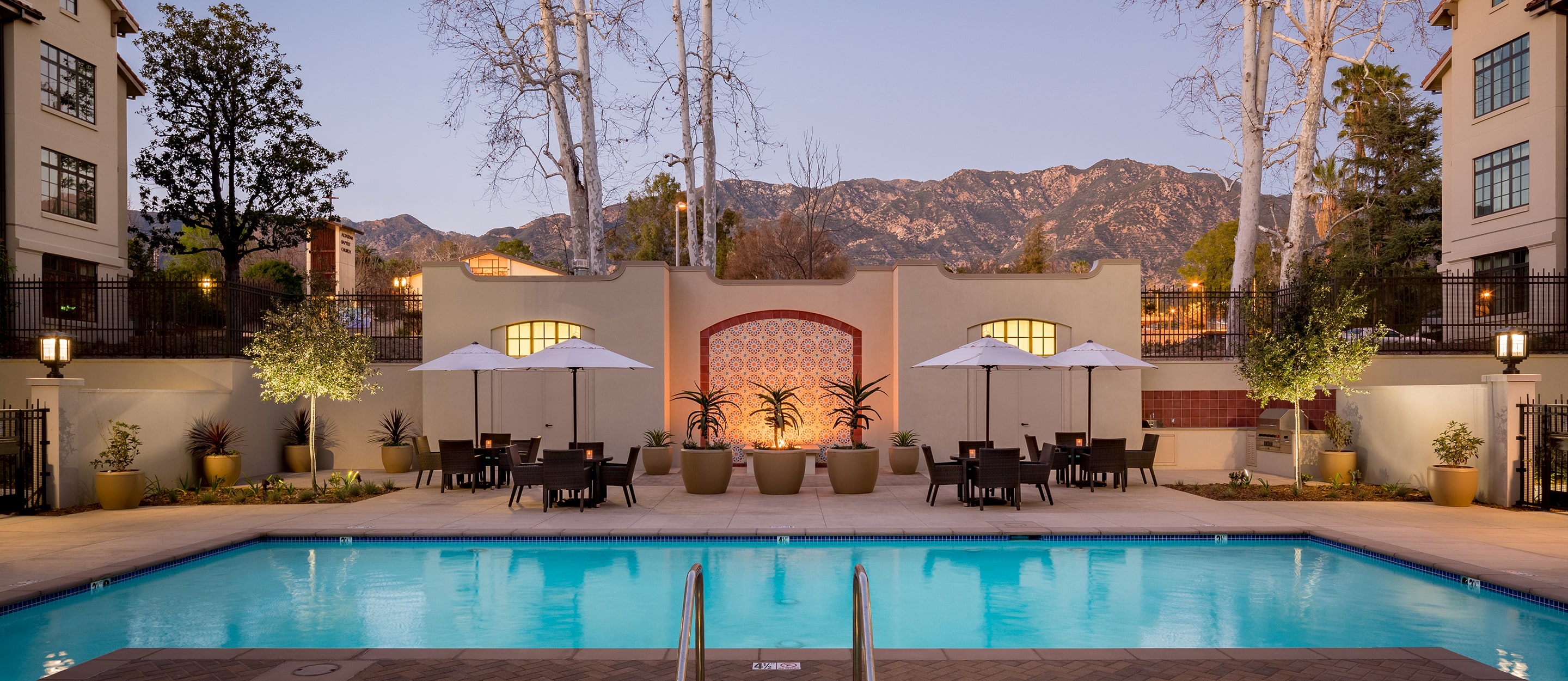 Serene swimming pool at dusk exemplifies luxury senior living in Pasadena