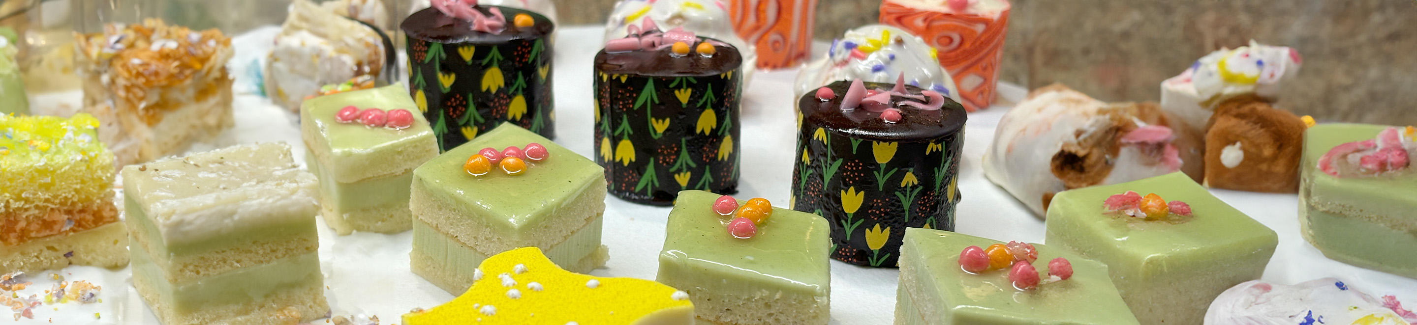 Various dessert canapes displayed along table